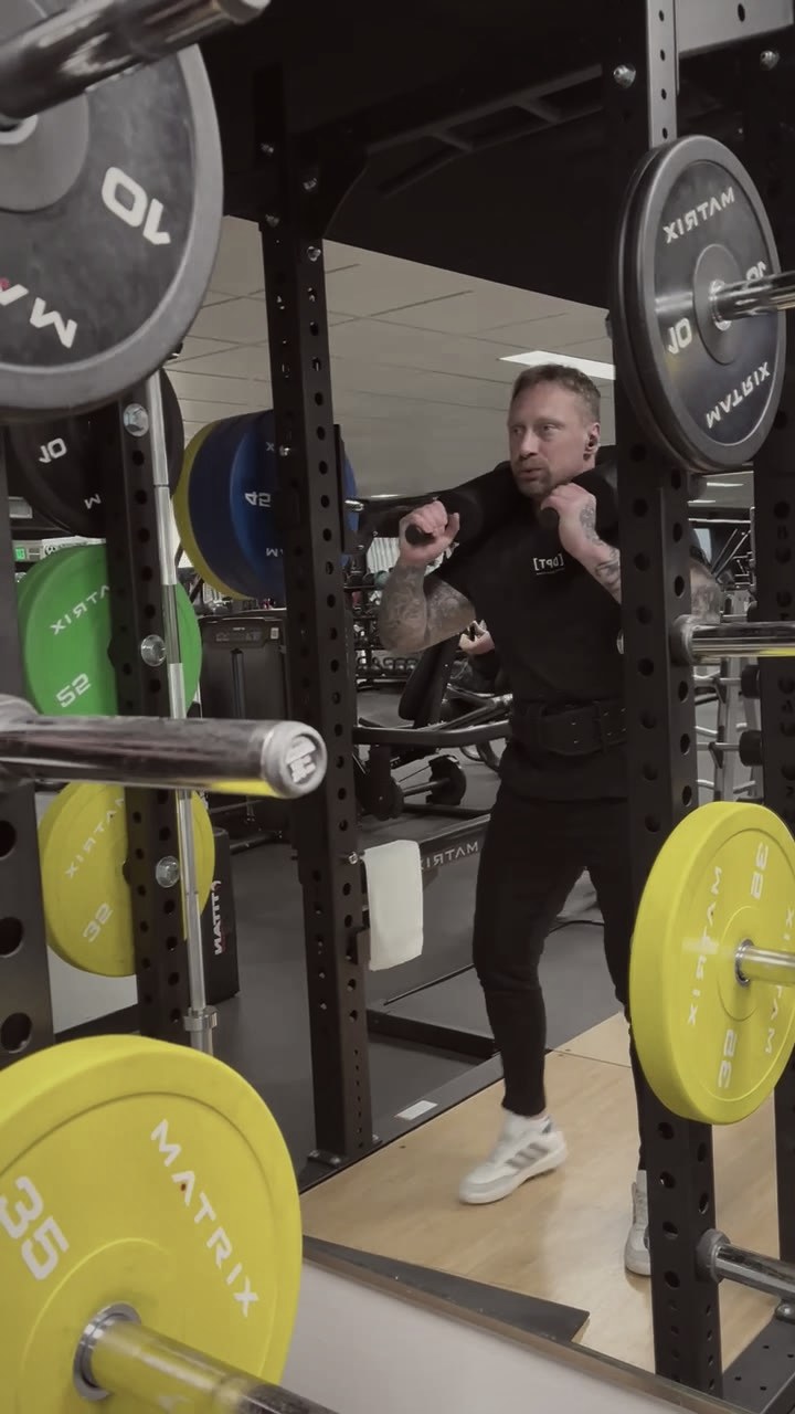 Phillip Walsh setting up a squat in the rack